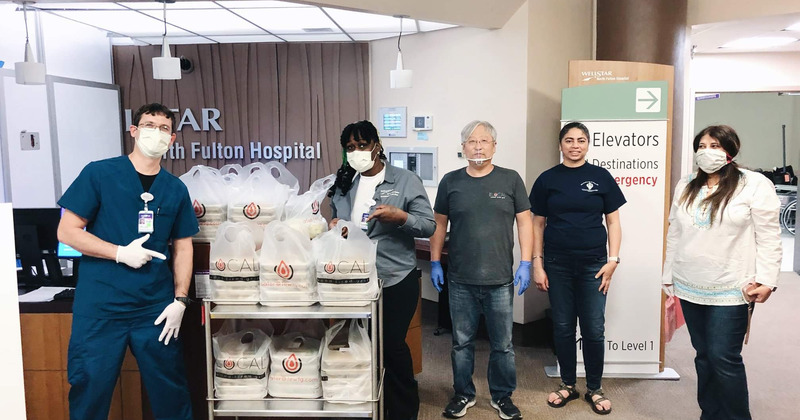 Employees donating to the hospital