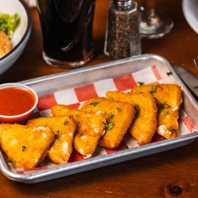 Mozzarella Wedges with a cup of marinara sauce.