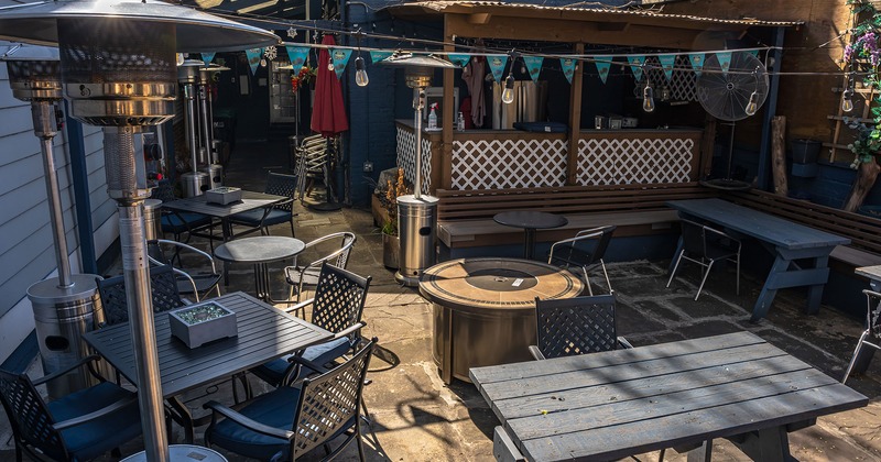 Patio, seating area with tables and chairs