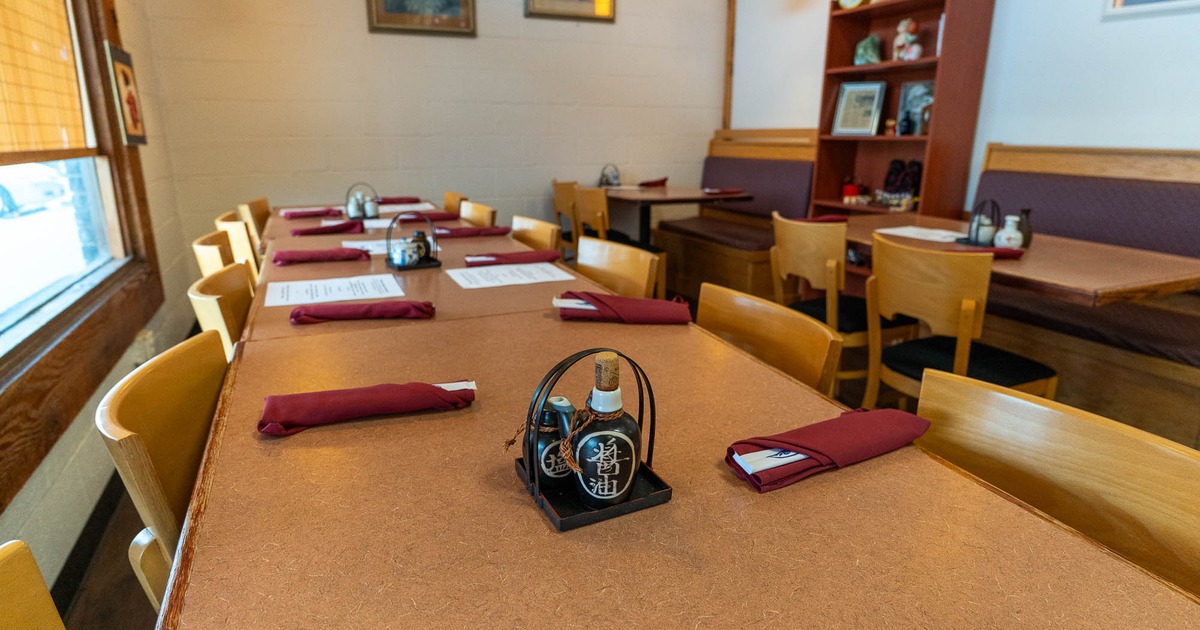 Interior, tables with  chairs and tableware