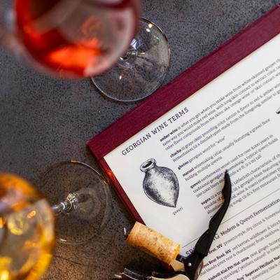 Georgian wine list with picture of a qvevri, a traditional Georgian winemaking vessel
