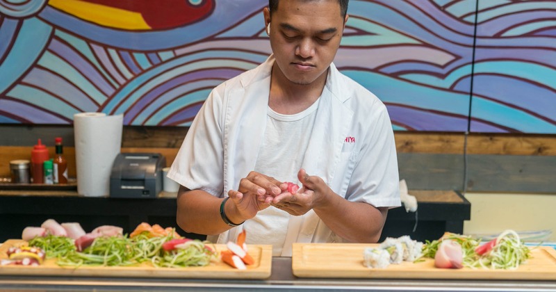 Employee making sushi