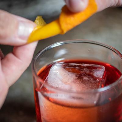 Hands preparing a drink.