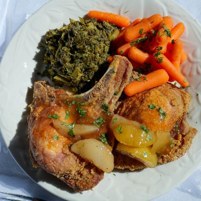 Fried porkchops with collard greeens,  glazed carrots and fried apples.