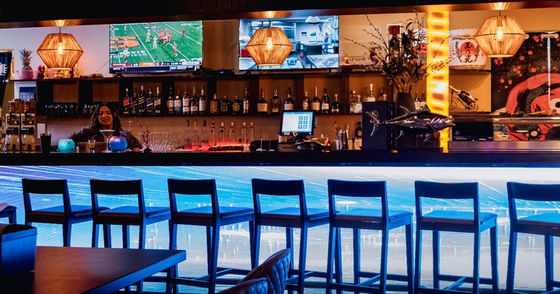 Bar area, bar stools neatly lined up