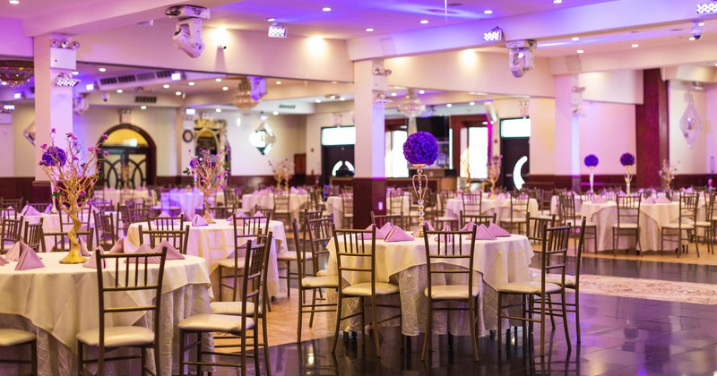Banquet hall, tables decorated with flowers