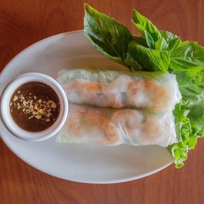 Fresh spring rolls with shrimp and peanut dipping sauce on the side.