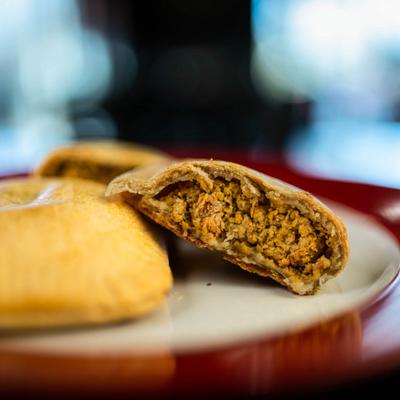 Meat pie with seasoned filling.