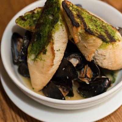 Steamed Mussels w/ White Wine, Butter, Garlic, Shallots and Parsley.