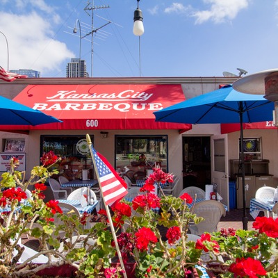 Exterior, seating area with parasols, flowers.