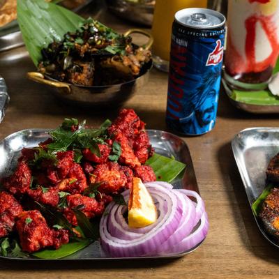 Tandoori Chicken and a can of Thumbs Up Soda.