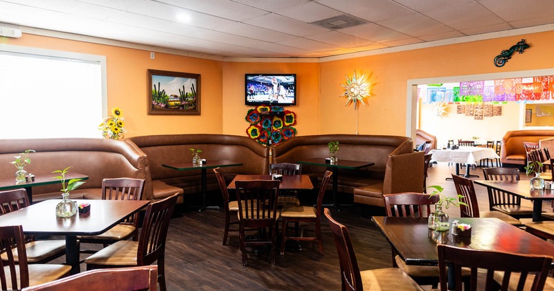 Interior, dining room with booth, tables and chairs