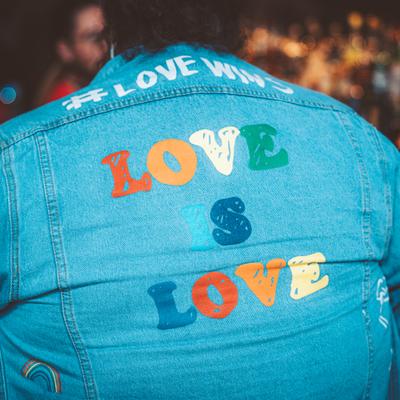 Love S Love printed on a person's denim jacket