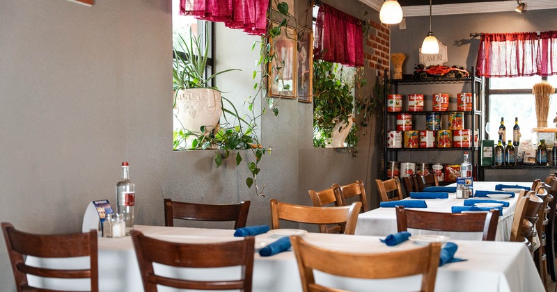 Interior, tables and chairs in dining area