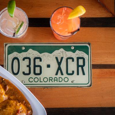 The Slopper burger, Hurricane and Watermelon Margarita cocktail, top view