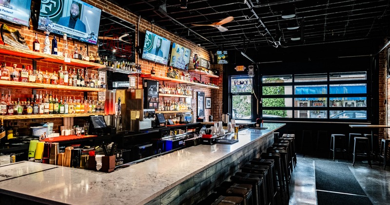 Interior, bar area, marble top bar with stools, bar entrance, shop window