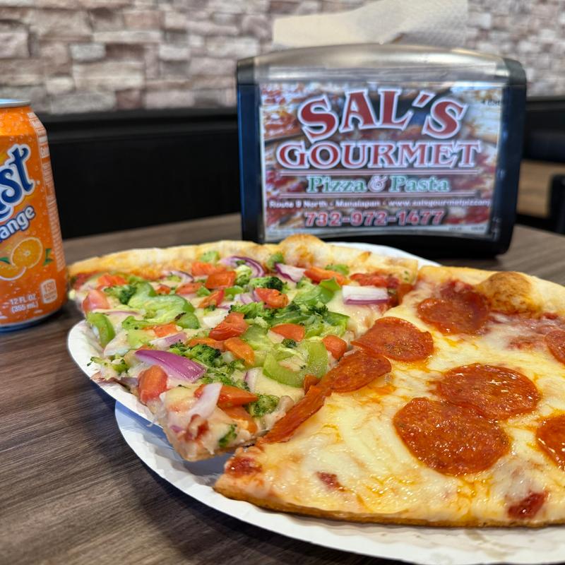 Any 2 Slices & Soda Can photo