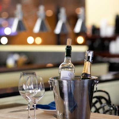 Interior, Champagne basket serve on a table with glasses and plates.