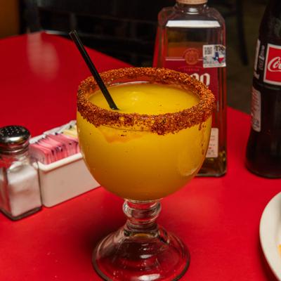 Mango margarita in a chili-rimmed glass.