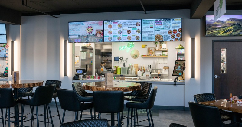 Interior, tables and chairs in dining area