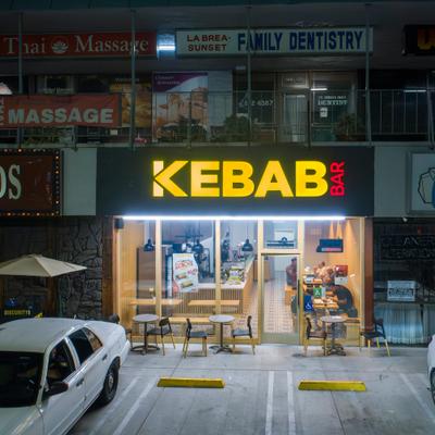 The restaurant's entrance and the parking in front.