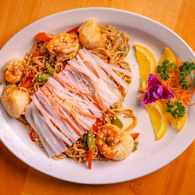Seafood Yakisoba topped with imitation crab meat, shrimp and large scallops.