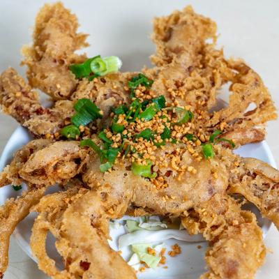 Deep Fried Soft Shell Crab, topped with scallions.
