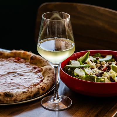 Pizza, wine, salad.