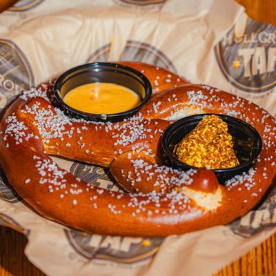 Large soft pretzel served with beer cheese dip and whole grain mustard.