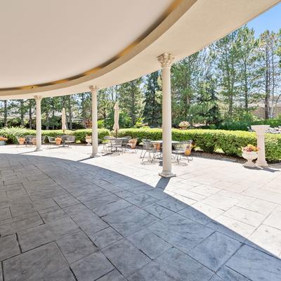 Covered patio area with tables and chairs