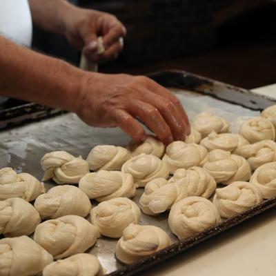 Chef preparing garlic knots.