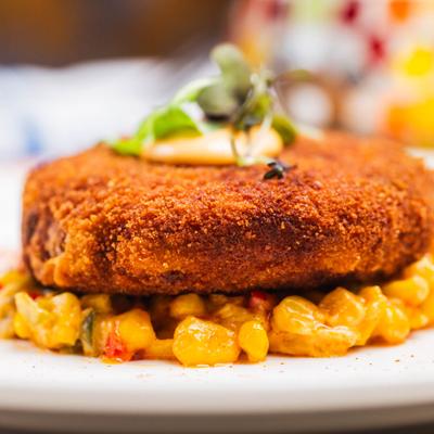 Maryland Crab Cake served over sweet corn.