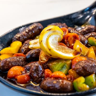 Sauteed sausage with mixed bell peppers and cherry tomato with garlic and lemon juice.