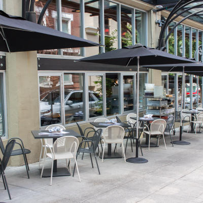Outdoor dining space with umbrellas for shade