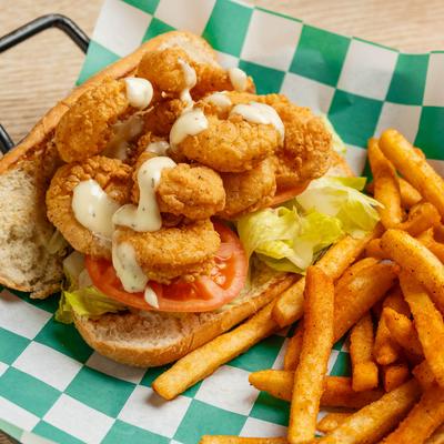 Fried shrimp po boy and fries.