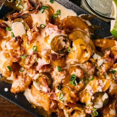 Irish nachos topped with melted cheese.