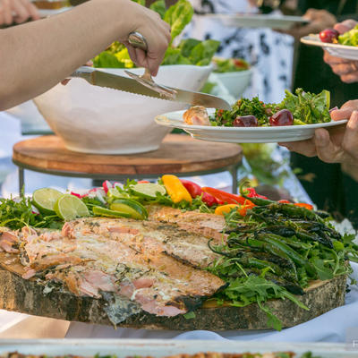 Dishes ready for service, guests tasting food