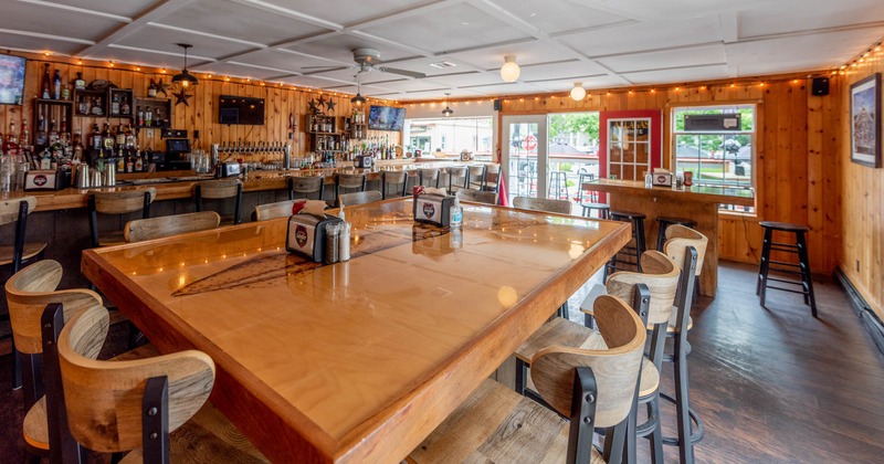 Interior, a large table with seats, bar, table with bar stools