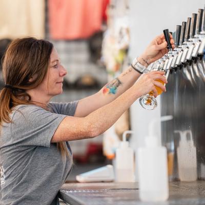 Pouring beer from the tap.