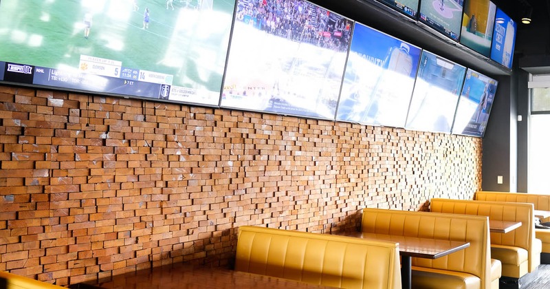 Interior, tables and yellow leather seating
