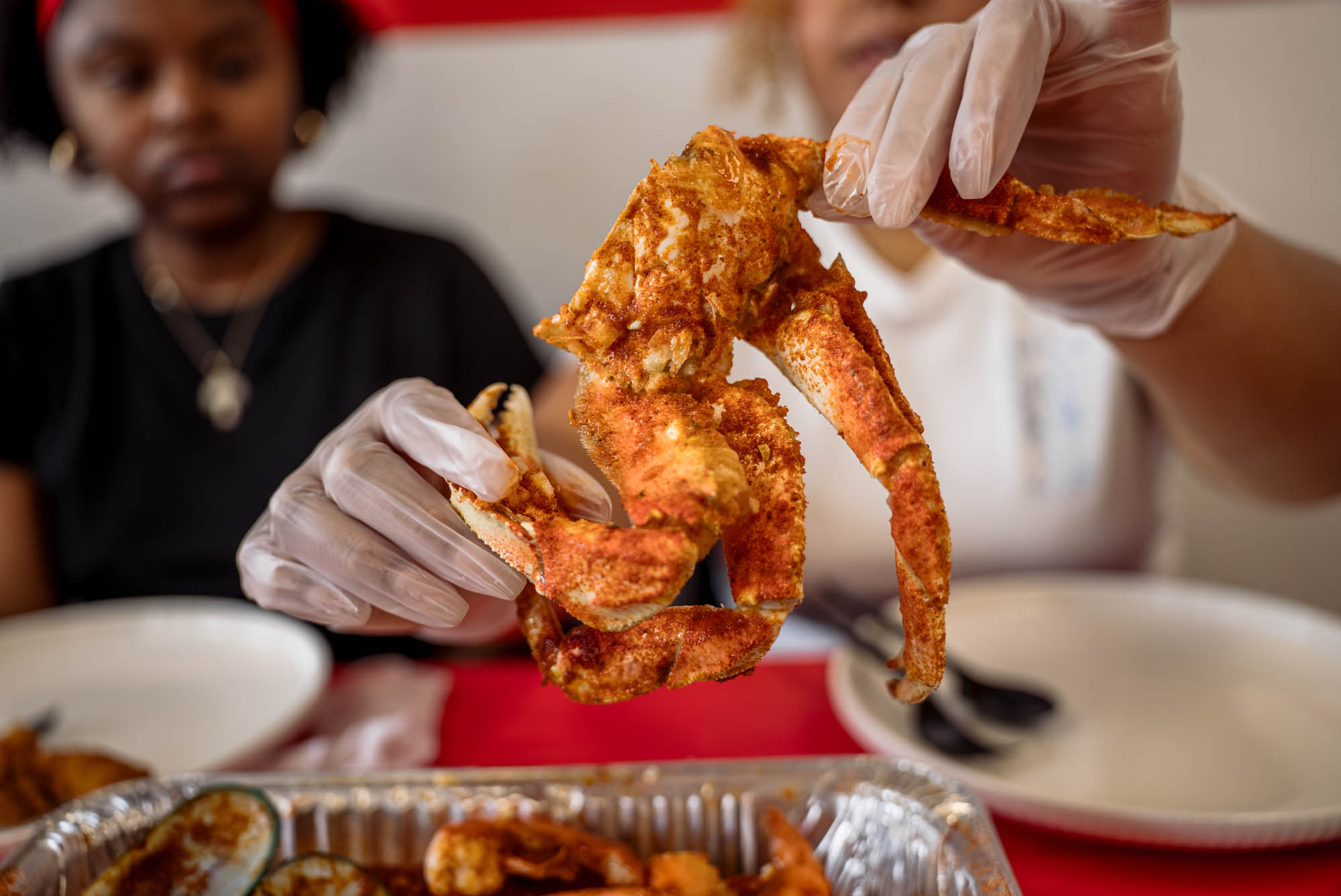 Hands holding seafood