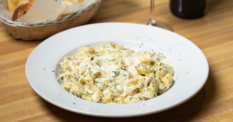 Cheese tortellini served in a creamy Alfredo sauce
