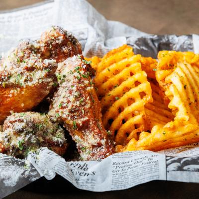 Garlic parmesan chicken wings, with waffle fries.