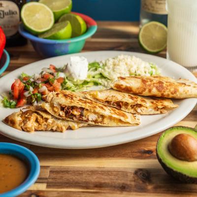 Quesadilla served with rice, lettuce, pico de gallo, and sour cream.