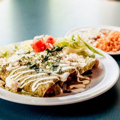 Stuffed pastry with meat, salad on the side
