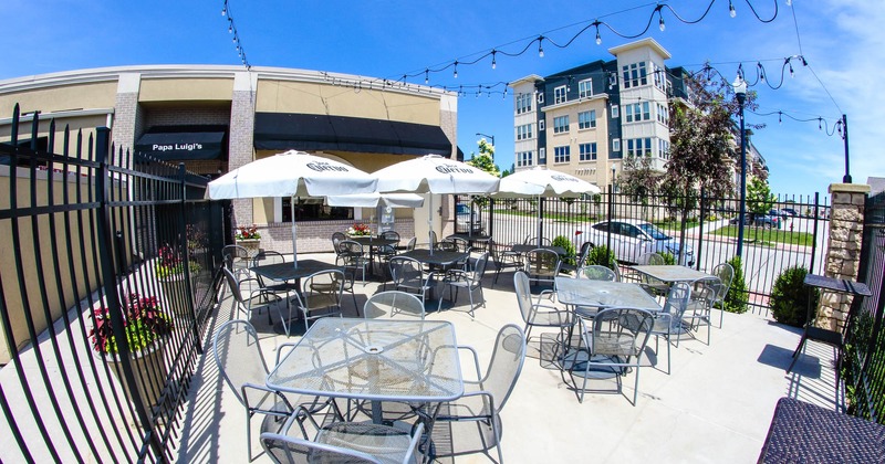 Exterior, seating area in patio with parasols