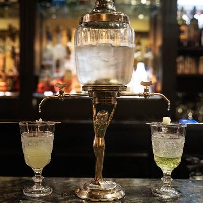 absinthe container and glasses.