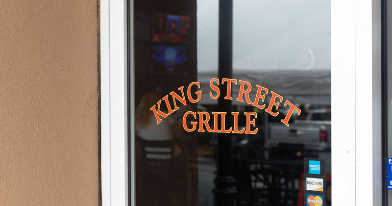 Shot of front door with logo saying King Street Grille