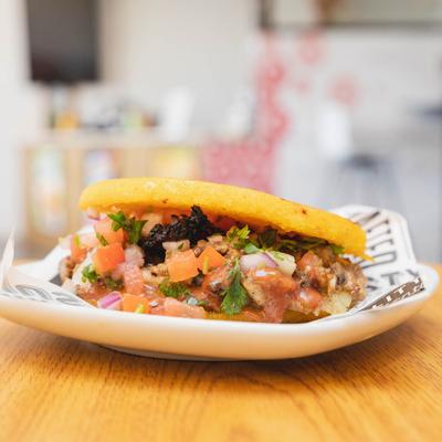 Chicken sandwich with salsa.