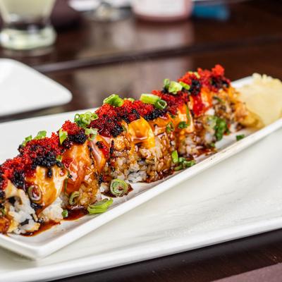 Dragon sushi rolls on a plate.